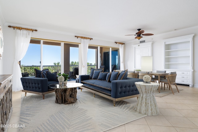 living area featuring light tile patterned floors, visible vents, crown molding, and ceiling fan