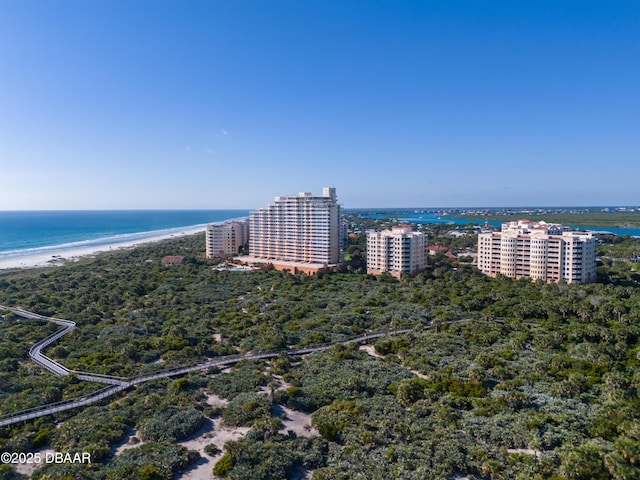 bird's eye view featuring a view of city, a beach view, and a water view