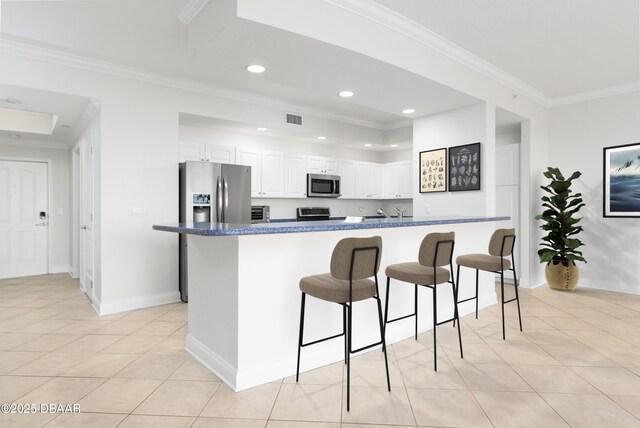 kitchen with white cabinetry, ceiling fan, an island with sink, light tile patterned floors, and appliances with stainless steel finishes