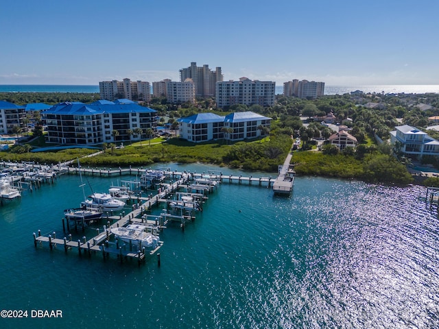 birds eye view of property with a water view