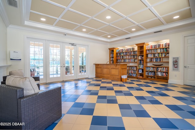 living area with visible vents, coffered ceiling, french doors, and ornamental molding