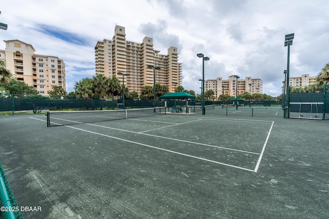 view of tennis court with fence