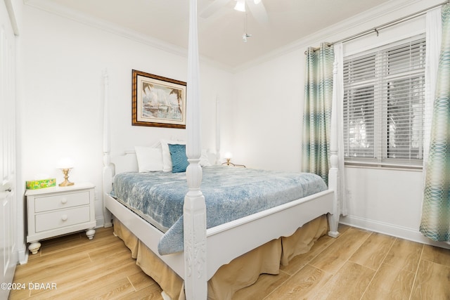 bedroom featuring ceiling fan, light hardwood / wood-style flooring, and crown molding