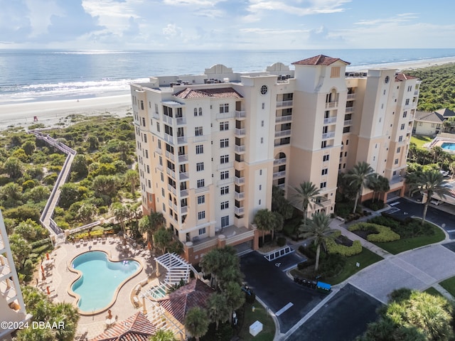 bird's eye view with a water view and a view of the beach