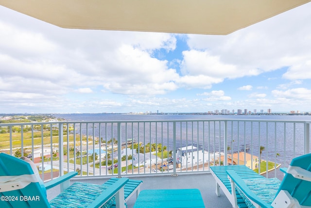 balcony featuring a water view