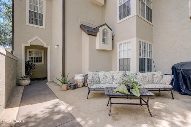 view of patio / terrace with an outdoor living space and a grill