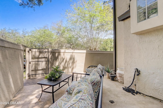 view of patio featuring fence