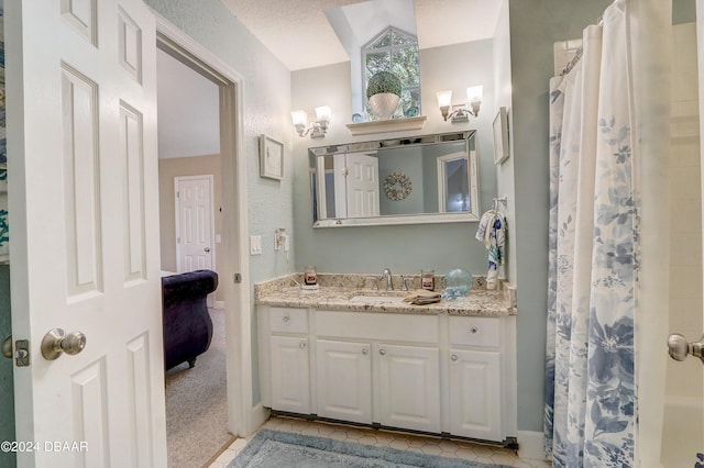 bathroom with tile patterned flooring, vanity, and a shower with curtain