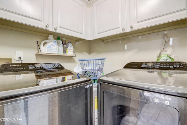 laundry area featuring washer and dryer and cabinet space