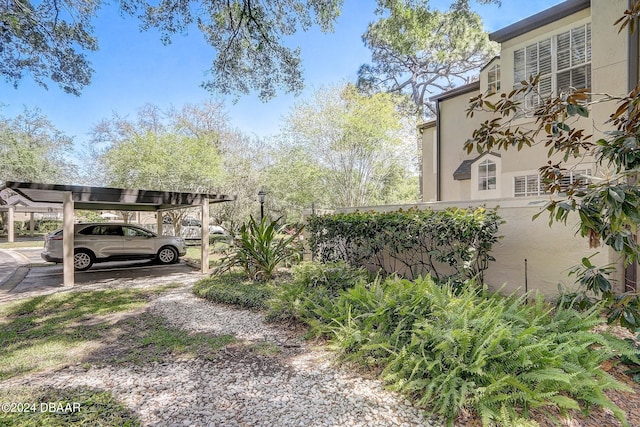 exterior space with a carport