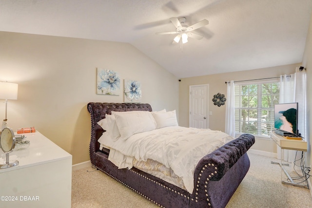 bedroom with baseboards, light carpet, ceiling fan, and vaulted ceiling