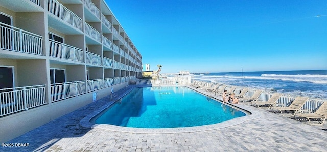 219 S Atlantic Ave Unit 120, Daytona Beach, FL 32118 - pool featuring a beach view, a patio area, and a water view