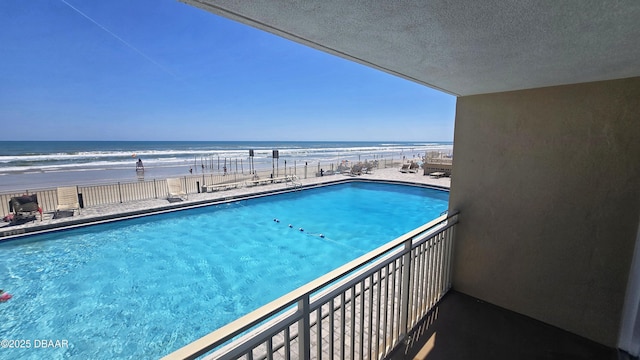 219 S Atlantic Ave Unit 120, Daytona Beach, FL 32118 - view of pool featuring a water view and a view of the beach