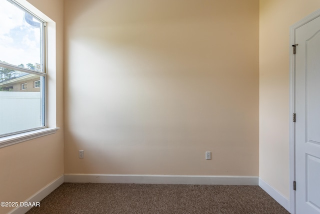 26 Ethel Ln, Palm Coast, FL 32164 - carpeted empty room featuring baseboards and plenty of natural light