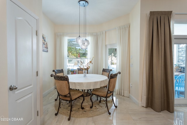 dining space featuring an inviting chandelier