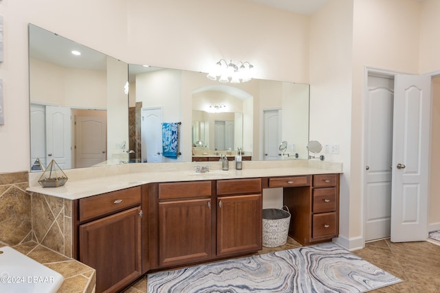 bathroom featuring a high ceiling, vanity, and tile patterned floors