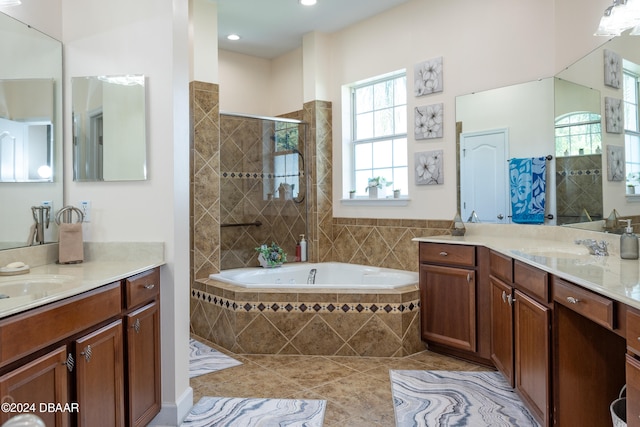 bathroom with separate shower and tub, tile patterned flooring, and vanity