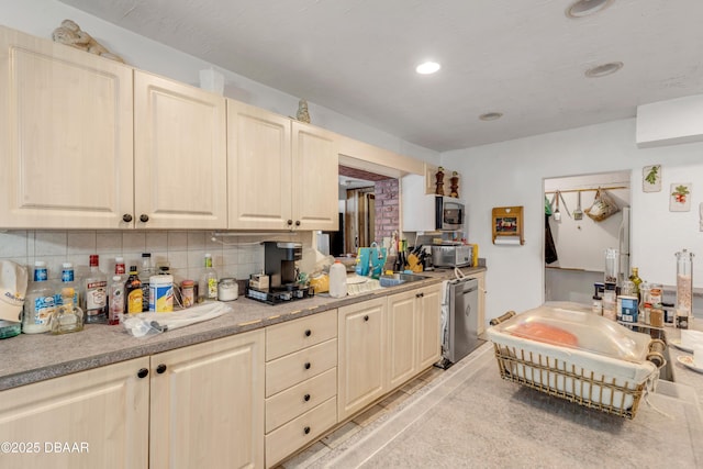 327 Due E St, New Smyrna Beach, FL 32169 - kitchen with dishwasher, backsplash, light countertops, recessed lighting, and a sink