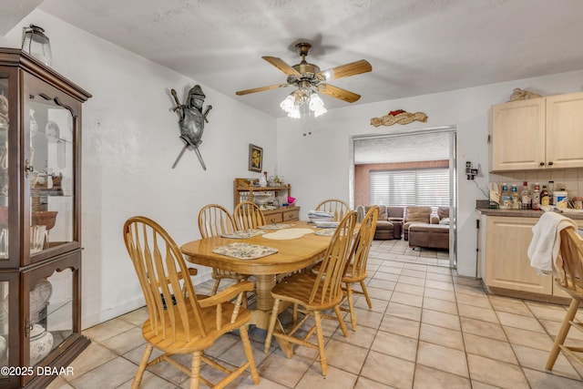 327 Due E St, New Smyrna Beach, FL 32169 - dining area featuring light tile patterned flooring and a ceiling fan