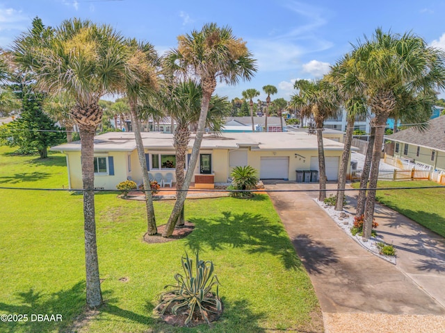 327 Due E St, New Smyrna Beach, FL 32169 - view of front of property with concrete driveway, stucco siding, and an attached garage
