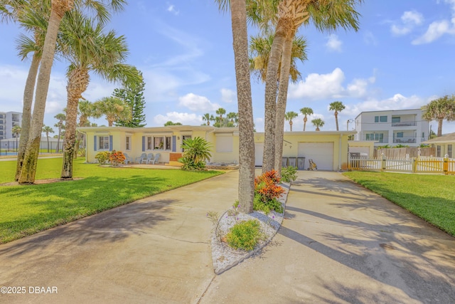327 Due E St, New Smyrna Beach, FL 32169 - view of front facade featuring driveway, a garage, and stucco siding