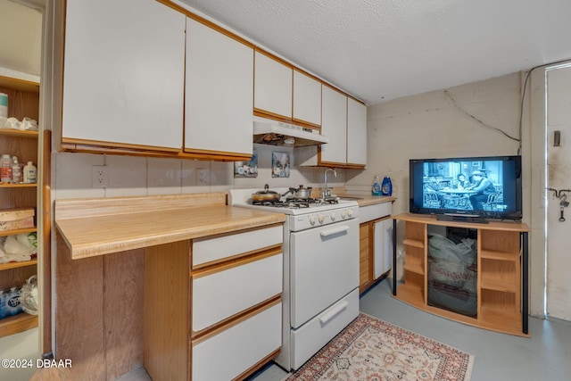 kitchen with white cabinetry, a textured ceiling, sink, and white gas range oven