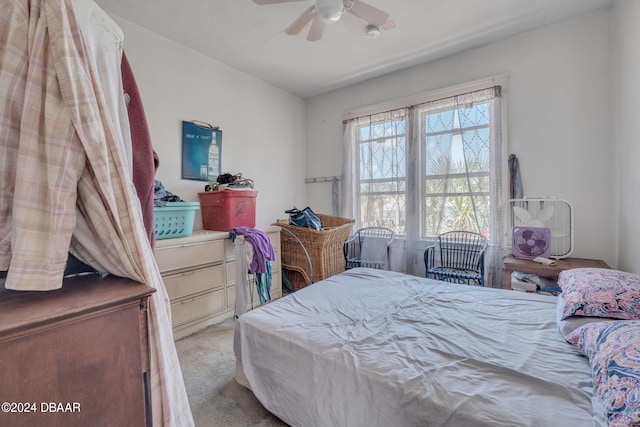 bedroom with ceiling fan and light colored carpet