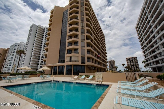 view of swimming pool featuring a patio area