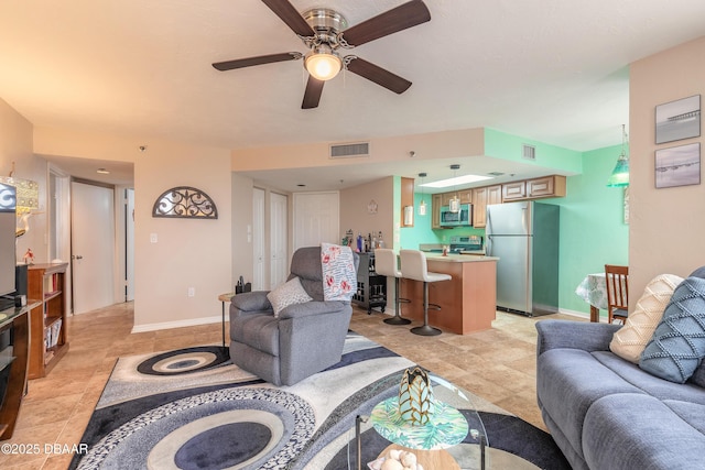 living room featuring ceiling fan