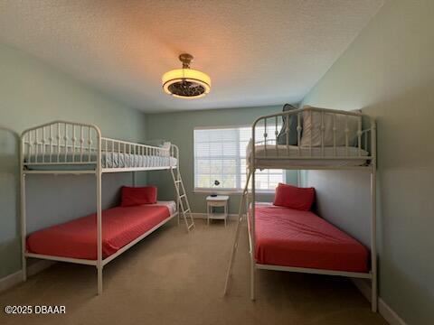 610 S Atlantic Ave, New Smyrna Beach, FL 32169 - bedroom with carpet and baseboards