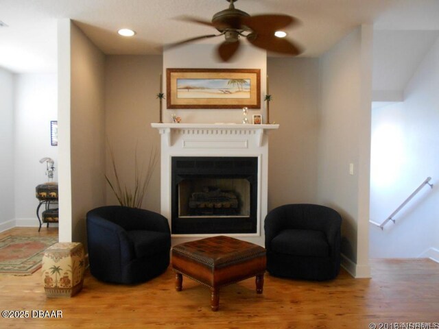 610 S Atlantic Ave, New Smyrna Beach, FL 32169 - living room featuring wood finished floors, baseboards, a fireplace, ceiling fan, and recessed lighting