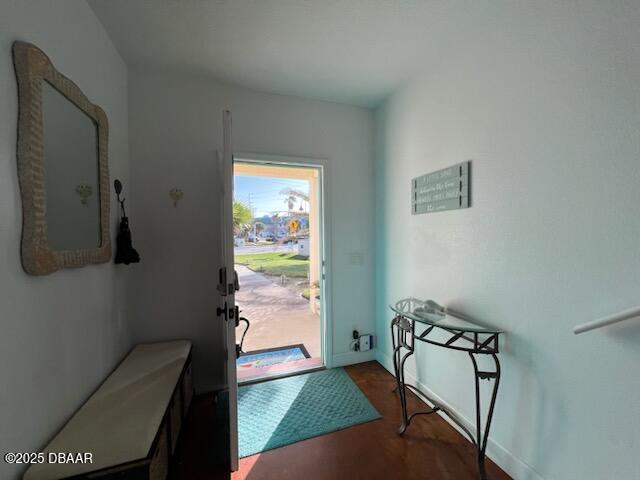 610 S Atlantic Ave, New Smyrna Beach, FL 32169 - entrance foyer with dark wood-style floors and baseboards