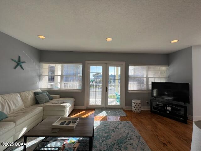 610 S Atlantic Ave, New Smyrna Beach, FL 32169 - living area with baseboards, wood finished floors, and recessed lighting