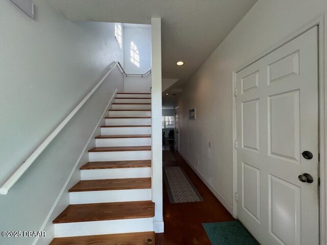 610 S Atlantic Ave, New Smyrna Beach, FL 32169 - stairs featuring recessed lighting, wood finished floors, and plenty of natural light