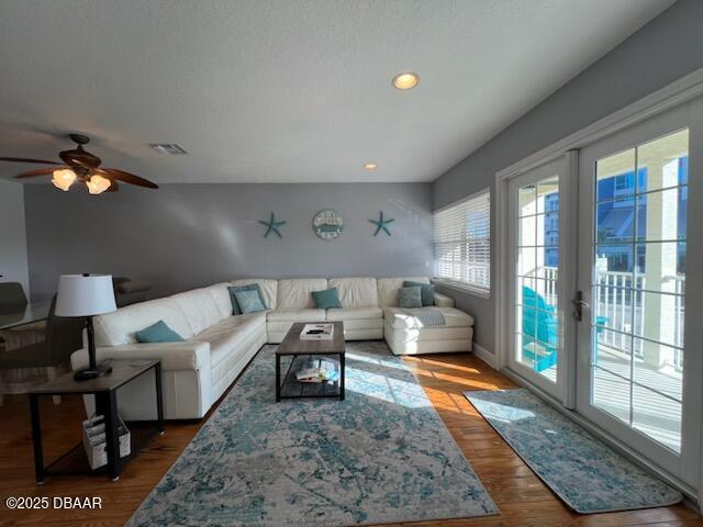 610 S Atlantic Ave, New Smyrna Beach, FL 32169 - living area featuring a ceiling fan, wood finished floors, and recessed lighting