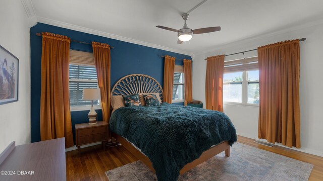 131 Mitchell Pl, Daytona Beach, FL 32118 - bedroom with wood finished floors, crown molding, and ceiling fan