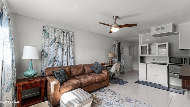 living room with light tile patterned floors and ceiling fan