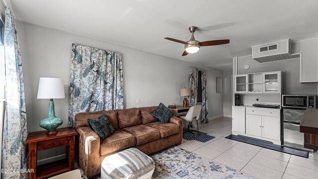 131 Mitchell Pl, Daytona Beach, FL 32118 - living room featuring ceiling fan and light tile patterned floors