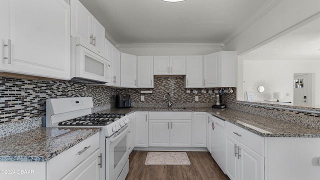 kitchen featuring dark stone countertops, white cabinetry, dark wood-type flooring, and white appliances