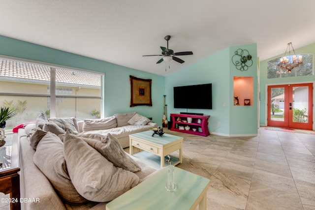 living room with lofted ceiling, ceiling fan, and french doors