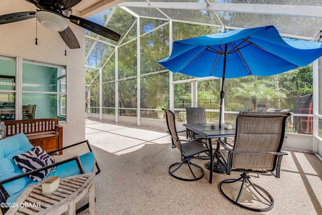 sunroom featuring ceiling fan