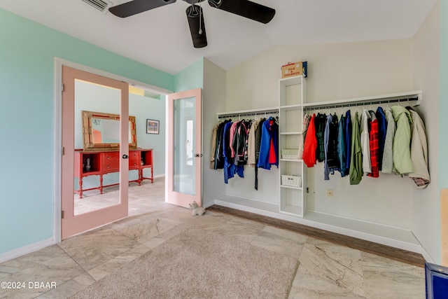 interior space with vaulted ceiling and ceiling fan