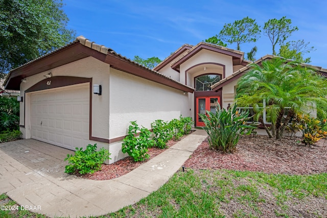 mediterranean / spanish-style house featuring a garage