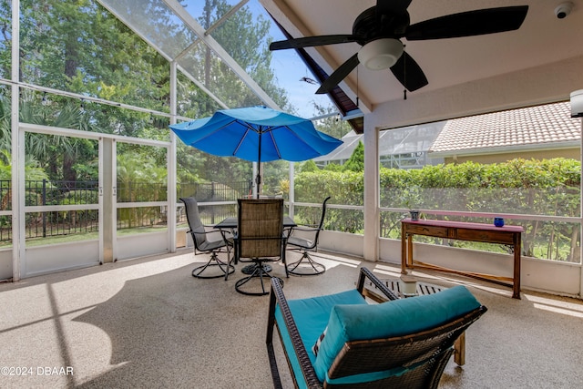 sunroom featuring ceiling fan