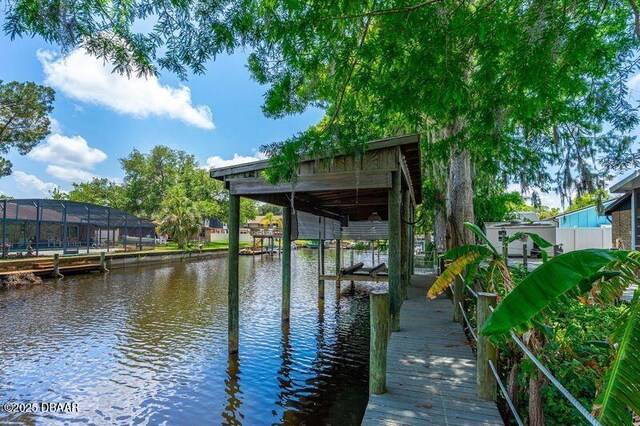 32 Twin River Dr, Ormond Beach, FL 32174 - dock area featuring a water view and boat lift