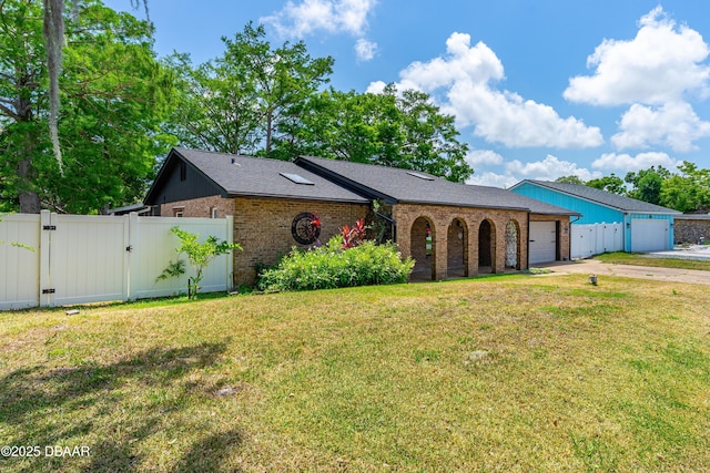 32 Twin River Dr, Ormond Beach, FL 32174 - view of front of property featuring fence, brick siding, a garage, a gate, and concrete driveway