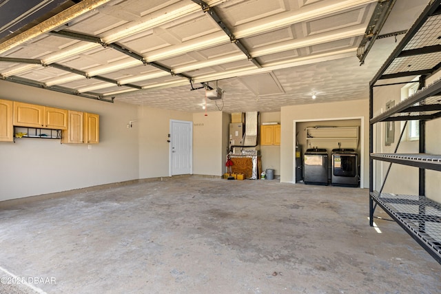 32 Twin River Dr, Ormond Beach, FL 32174 - garage with washing machine and dryer and a garage door opener