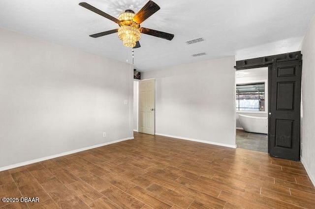 32 Twin River Dr, Ormond Beach, FL 32174 - spare room with baseboards, a ceiling fan, wood finished floors, and visible vents