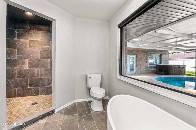 32 Twin River Dr, Ormond Beach, FL 32174 - bathroom featuring a freestanding bath, a tile shower, toilet, recessed lighting, and baseboards
