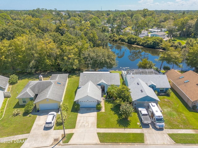 birds eye view of property with a water view